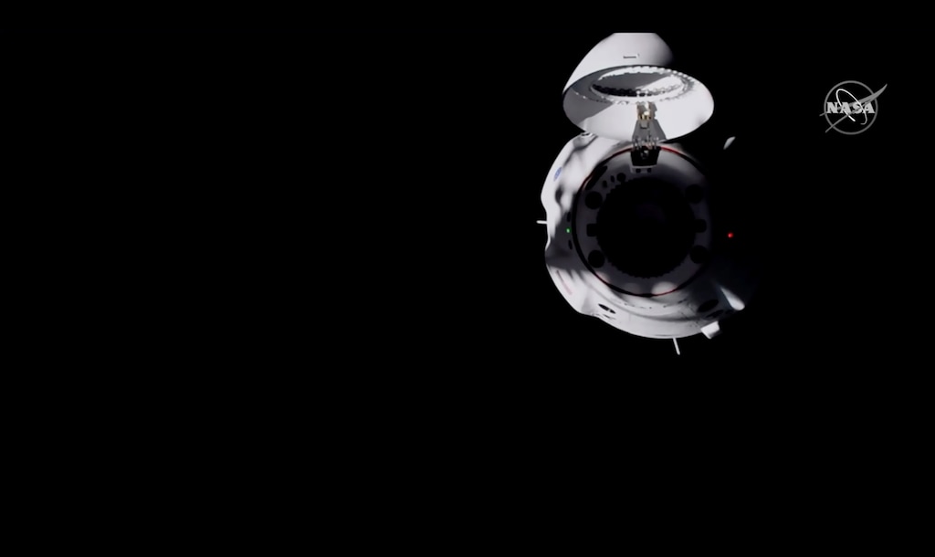 (NASA TV via AP) In this frame grab from NASA TV, the SpaceX Dragon capsule approaches the International Space Station, late Monday, Nov. 16, 2020.