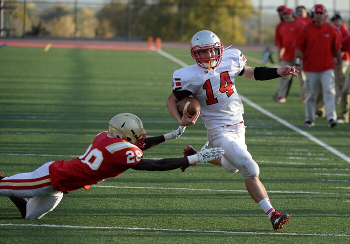 (Francisco Kjolseth  |  The Salt Lake Tribune)  Fredrick Charles of Judge stretches out for a tackle attempt as Lance Fowles comes close to a touchdown in the Class 3A football playoff game on Thursday, Oct. 19, 2017. 