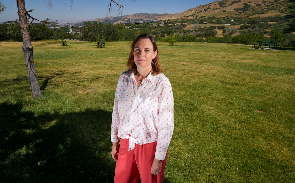 (Bethany Baker  |  The Salt Lake Tribune) Rachel Borup stands in Donner Trail Park in the St. Mary's neighborhood, an area where homeowners are losing their homeowners insurance due to fire risk, in Salt Lake City on Saturday, June 29, 2024.