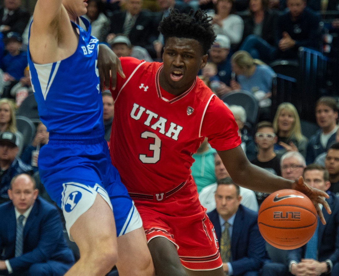 (Rick Egan  |  The Salt Lake Tribune)   Utah Utes forward Donnie Tillman (3) tires to work the ball inside, as against the Brigham Young Cougars forward Connor Harding defends, in basketball action in the Beehive Classic, between against the Brigham Young Cougars and Utah Utes, at the Vivint Smart Home Arena, Saturday December 8, 2018.