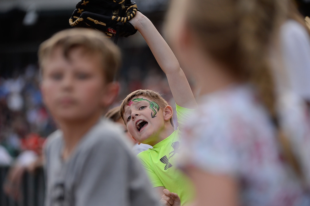 (Francisco Kjolseth  |  The Salt Lake Tribune)  Young fans try to persuade players for a ball as Utah and BYU renew their rivalry on the baseball diamond as they battle it out at Smith's Ballpark in Salt Lake City on Tuesday, May 14, 2019.