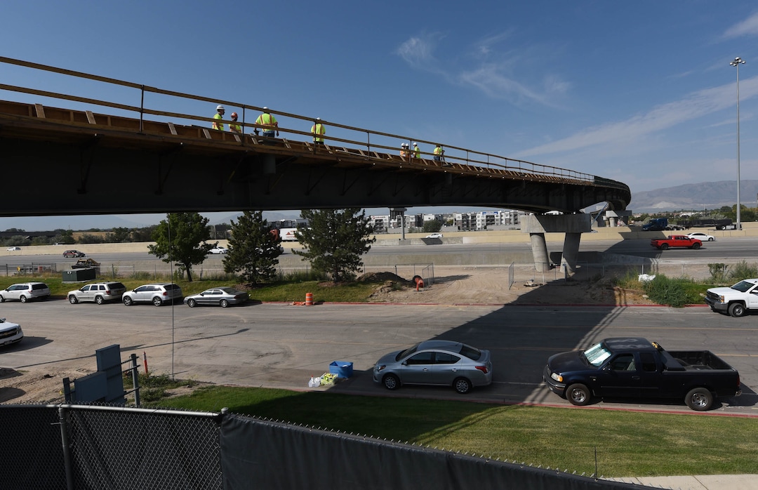 (Francisco Kjolseth  |  The Salt Lake Tribune) UDOT gives a tour of the state’s new longest pedestrian bridge on Thursday, August 20, 2020, connecting Utah Valley University in Orem to student housing and the community on the West side of I-15. Crews are finishing up an extensive hydronic heating system that will pump warm water to keep the bridge clear of snow in the winters, as it gets ready to pour concrete for the walking surface. UDOT will close I-15 in both directions this weekend for work on the nearly 1,000 foot bridge that is 15 feet wide to accommodate pedestrians, cyclists and scooters. Elevators and stairs with small ramps to push up bicycles will be on each side of the bridge.