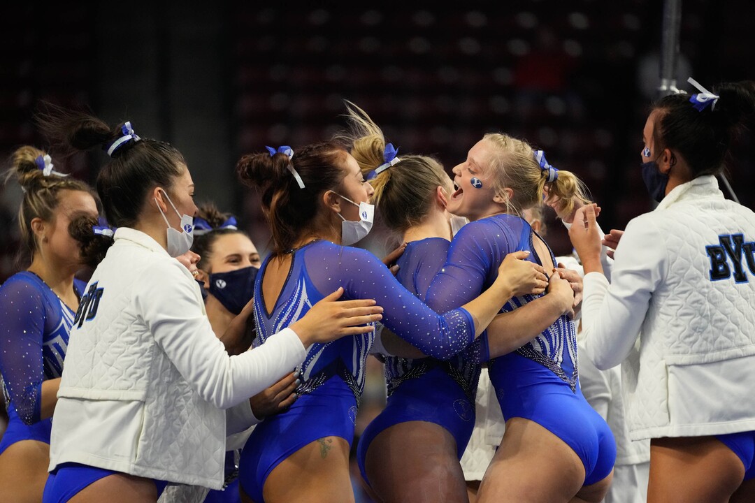 (Francisco Kjolseth | The Salt Lake Tribune) BYU celebrates their team performance on the bars at the Best of Utah NCAA Gymnastics Meet at the Maverik Center in West Valley City on Friday, Jan. 7, 2022.