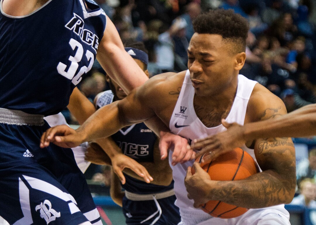 (Rick Egan  |  The Salt Lake Tribune)  Brigham Young Cougars guard Jahshire Hardnett (0) takes the ball up the middle in traffic, in basketball action between Brigham Young Cougars and Rice Owls, at the Marriott Center in Provo, Wednesday, Nov. 21, 2018.