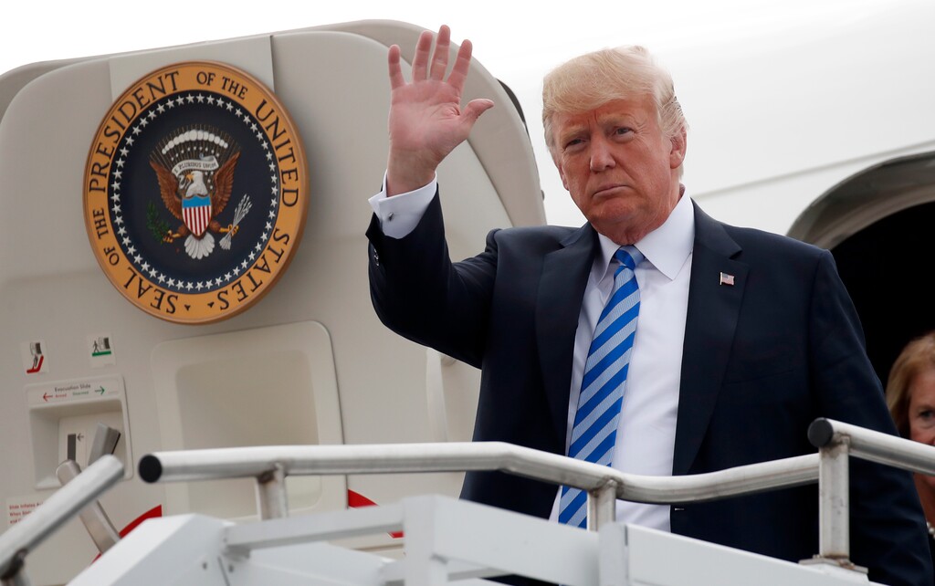 (AP Photo/Alex Brandon) President Donald Trump waves as he steps off Air Force One, Tuesday, Aug. 21, 2018, in Charleston, W.Va.
