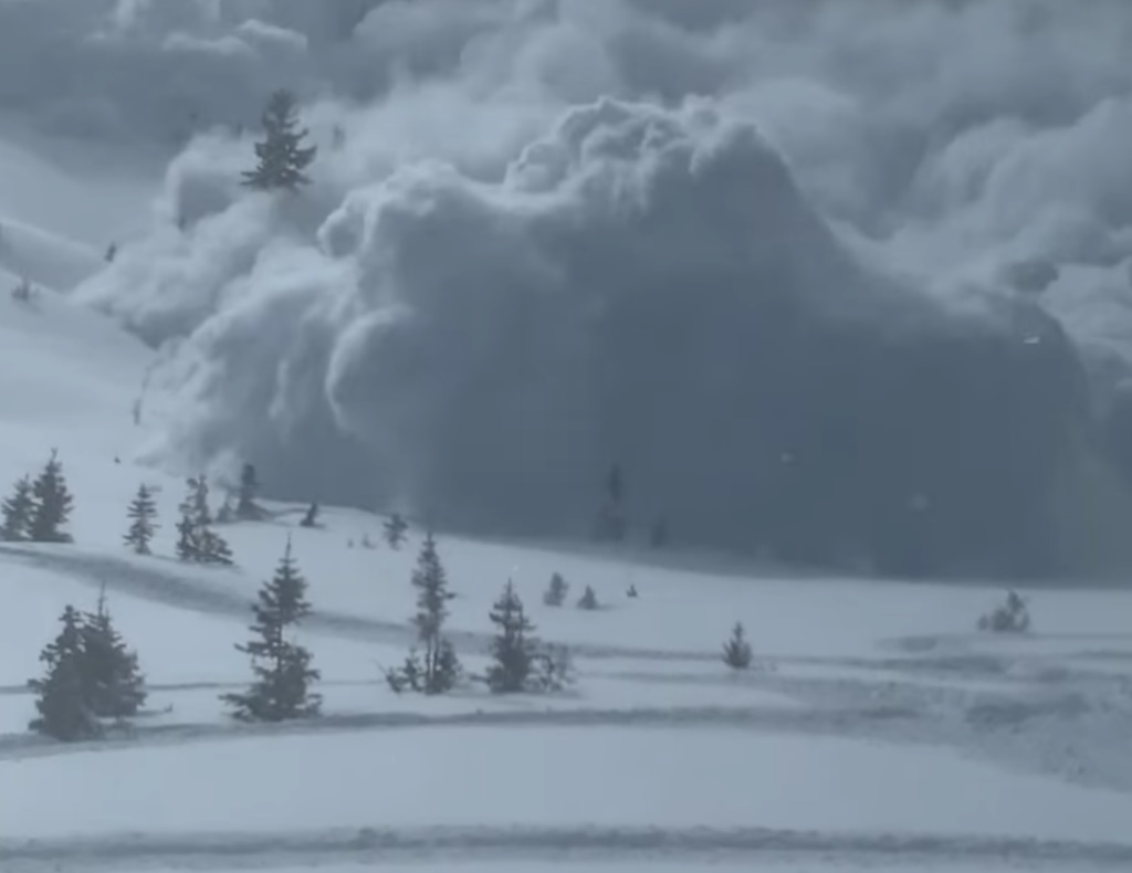 (Screen grab) An image from a video posted on social media by  Miles Penrose, showing a Saturday avalanche in the Uinta Mountains that broke loose above his group of snowmobilers.
