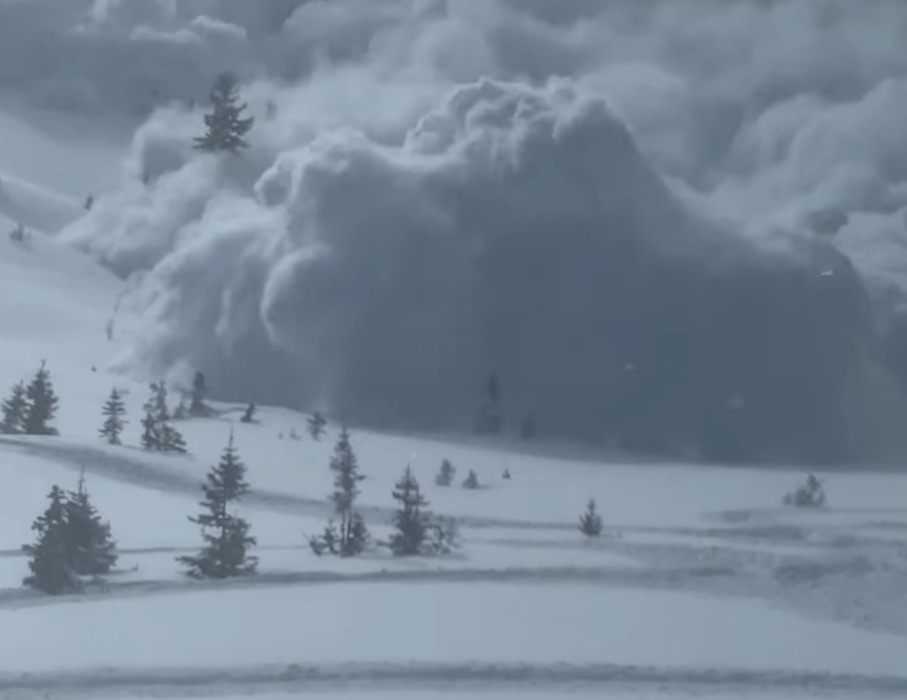 (Screen grab) An image from a video posted on social media by  Miles Penrose, showing a Saturday avalanche in the Uinta Mountains that broke loose above his group of snowmobilers.