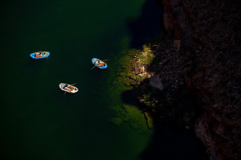 (Trent Nelson  |  The Salt Lake Tribune) Rafts on the Colorado River as seen from Navajo Bridge in Ariz. on Tuesday, May 20, 2025.