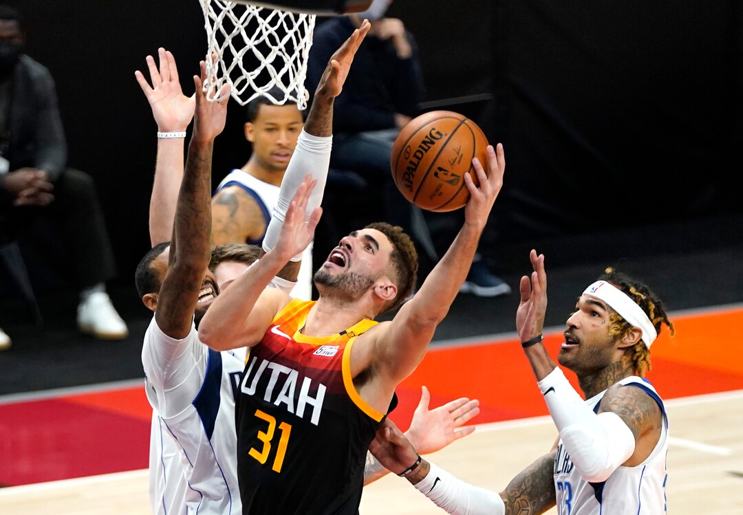 (Rick Egan | The Salt Lake Tribune)  Utah Jazz forward Georges Niang (31) goes up for a shot as Dallas Mavericks forward James Johnson (16) defends, in NBA action between the Utah Jazz and the Dallas Mavericks at Vivint Arena, on Friday, Jan. 29, 2021.