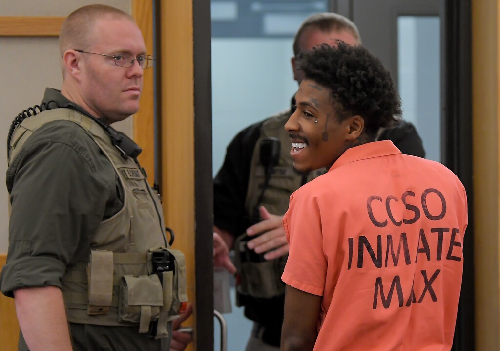 (Ei Lucero | Pool) Kentrell Gaulden, known as NBA YoungBoy, smiles as he leaves the courtroom following a hearing in 1st District Court, Thursday, May 9, 2024, in Logan. Gaulden, who has been charged with multiple felonies in relation to a fraudulent prescription operation, waived his right to a preliminary hearing and bail was set at $100,000.