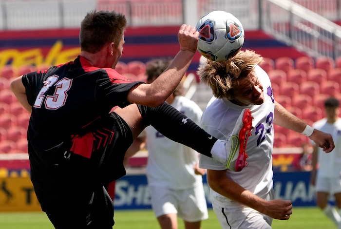 (Francisco Kjolseth | The Salt Lake Tribune) Alta’s Adam Rasmussen (23) goes up against Lehi’s Nate Shepherd (23) during their 5A State Soccer Championship title game at Rio Tinto Stadium, Wednesday, May 25, 2022. Alta defeated Lehi in shootout 3-1.