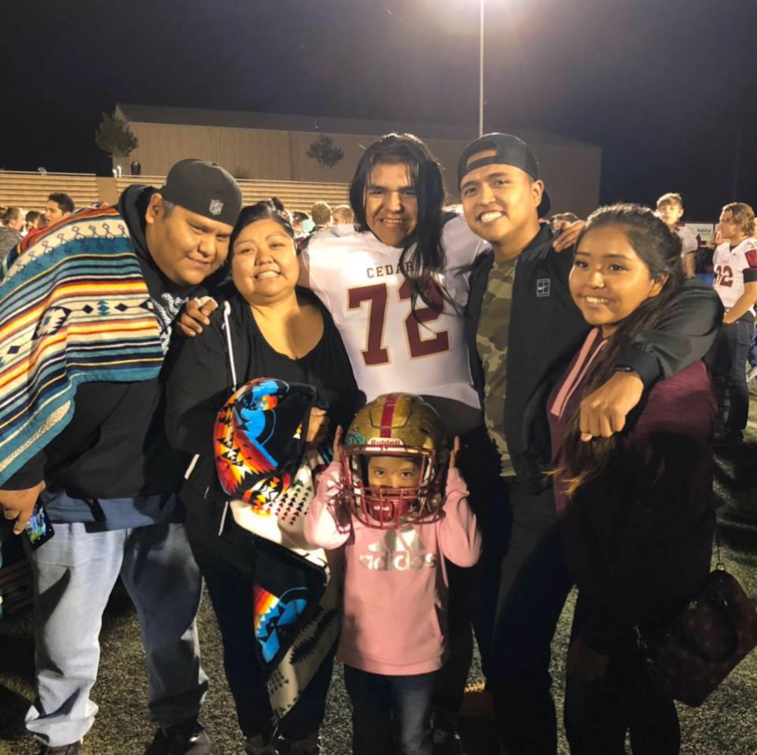 (Photo courtesy of Merrilee Ham) Merrilee Ham, second from left, celebrates with her family at a Cedar High School football game in 2018 in Cedar City. Her son, Cason, plays football for CHS, where officials are considering dropping the school's controversial team name: The Redmen. Ham and her husband, Aric, hail from the Paiute and Navajo tribes, respectively. Ham said her siblings, cousins and children have been proud CHS athletes under the Redmen name, but others have decried the mascot as a racial slur.