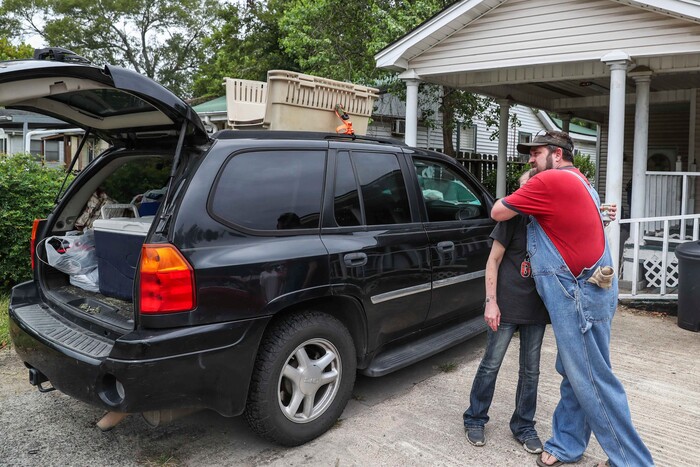 Bob Keen gives a big hug to Aubrey Trotti as they say goodbye after decided to evacuate the area. They realized they were not prepared to ride out the storm as Hurricane Laura approaches in West Orange on Wednesday, August 26, 2020. (Lola Gomez/Austin American-Statesman via AP)