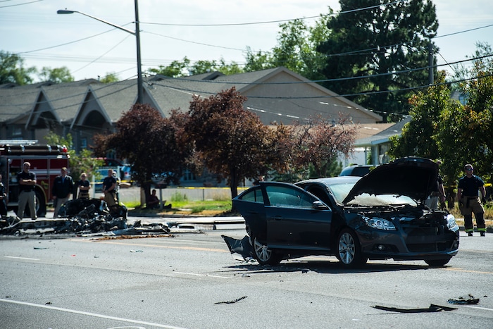 (Chris Detrick  |  The Salt Lake Tribune)  The scene of a plane crash at 1900 West and 4500 South in Roy Tuesday, September 12, 2017. The pilot of a single-engine airplane survived a fiery crash on a street in Roy Tuesday afternoon, authorities said. Roy police Sgt. Matthew Gwynn said the pilot was transported to a hospital “out of precaution,” as was the driver of a car that the plane hit.