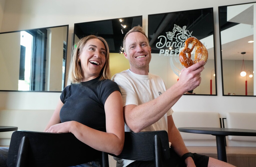 (Francisco Kjolseth  | The Salt Lake Tribune) Lindsay and Drew Sparks, co-owners of Dangerous Pretzel Co. in the Post District, pose for a portrait on Thursday, May 22, 2025.