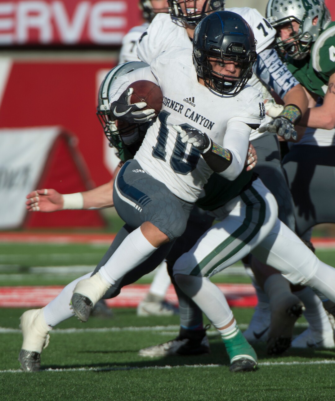 (Rick Egan  |  The Salt Lake Tribune)    Corner Canyon quarterback Austin Bell runs the ball for the Chargers, in 5A football semifinal action between Olympus and Corner Canyon at Rice-Eccles Stadium, Thursday, Nov. 8, 2018.