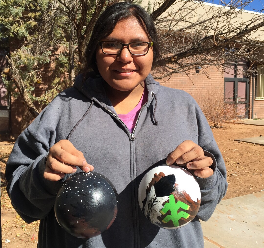 (Photo courtesy of Georgiana Simpson) A student at Whitehorse High School holds an ornament she painted.