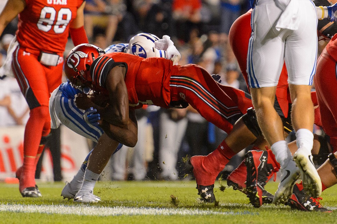 (Trent Nelson | The Salt Lake Tribune)  Utah Utes quarterback Tyler Huntley (1) dives for a touchdown as BYU hosts Utah, NCAA football in Provo, Saturday September 9, 2017.