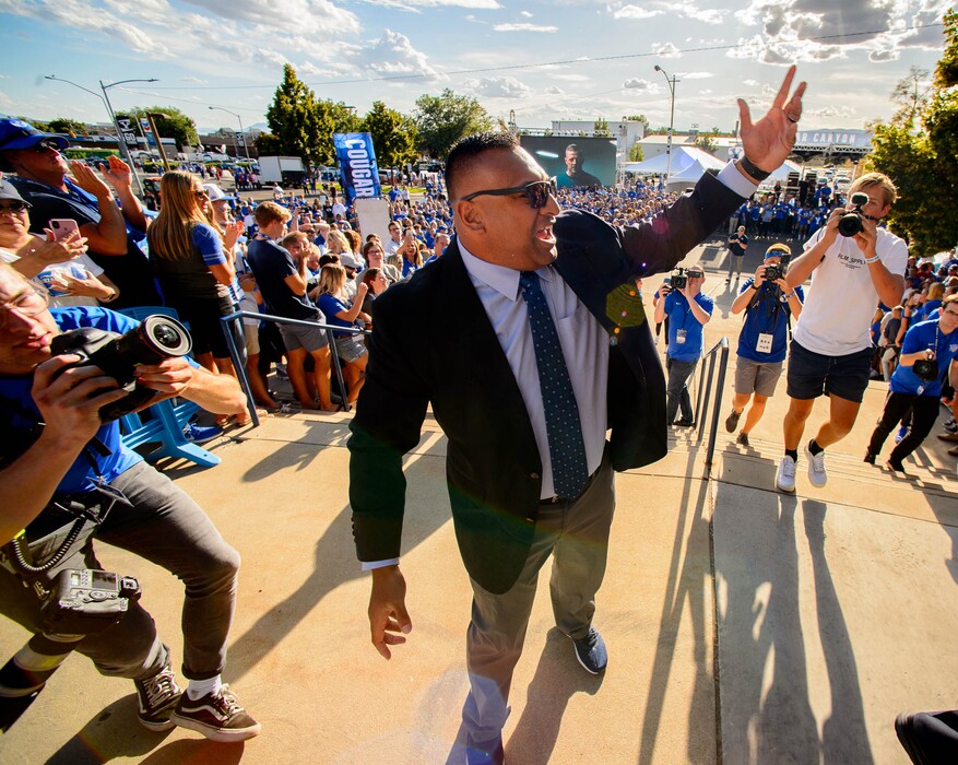 (Trent Nelson  |  The Salt Lake Tribune)  BYU football coach Kalani Sitake pumps up fans during the Cougar Walk, as Brigham Young University (BYU) hosts the University of Utah, NCAA football in Provo on Thursday Aug. 29, 2019.