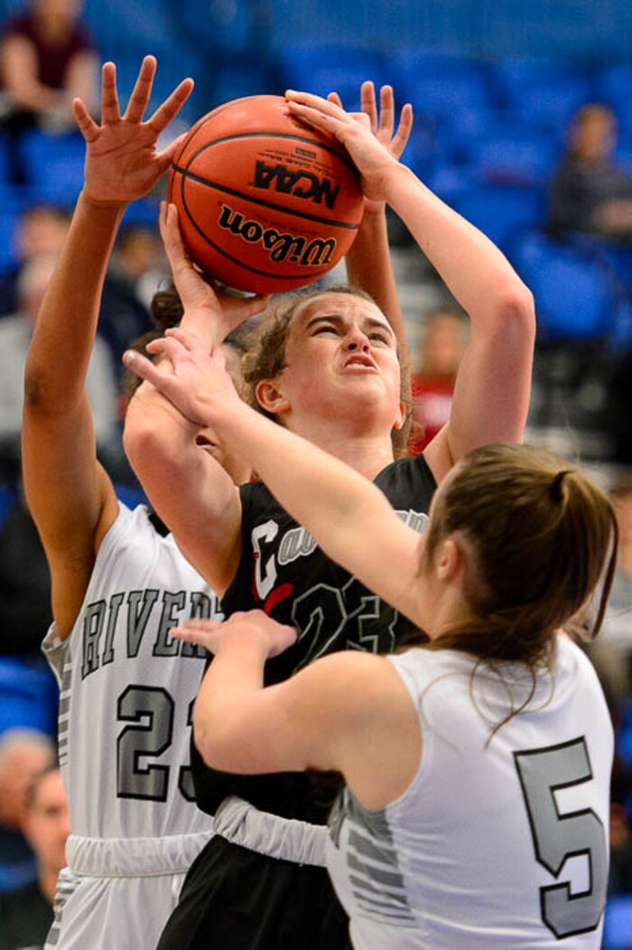(Trent Nelson | The Salt Lake Tribune)  American Fork's Sydney Bushman (23) defended by Riverton's Meredith Coleman (23) and Riverton's Hailey Burt (5) as Riverton faces American Fork in the 6A High School Girls' Basketball Tournament at SLCC in Taylorsville, Tuesday Feb. 20, 2018.