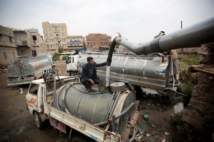 In this photo taken on Wednesday, Jul. 26, 2017, a man fills a tank lorry with water from a water-tap in Sanaa, Yemen. Yemen’s raging two-year conflict has served as an incubator for lethal cholera. (AP Photo/Hani Mohammed)