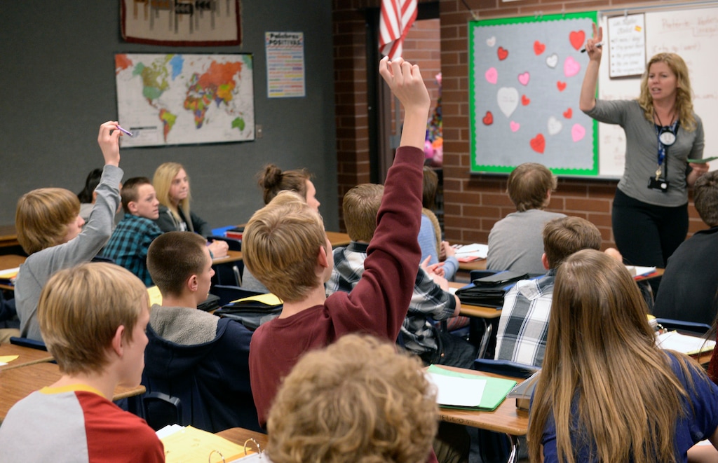 Al Hartmann | The Salt Lake Tribune
Students raise their hands in full classroom of 32 students in a Spanish class at South Jordan Middle School Monday Feb. 1. Lawmakers will consider a proposal to raise taxes to fund schools, which could pay for technology, teacher salaries and relieve pressure on over crowding.