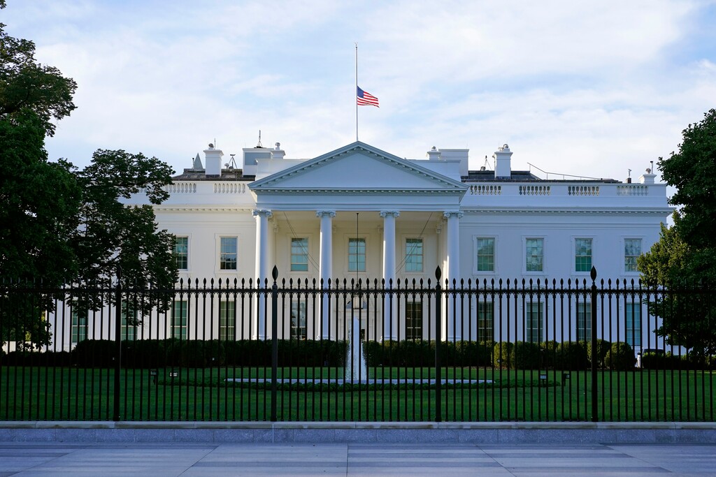 (Patrick Semansky | AP file photo)  An American flag flies at half-staff over the White House in Washington on Saturday, Sept. 19, 2020.