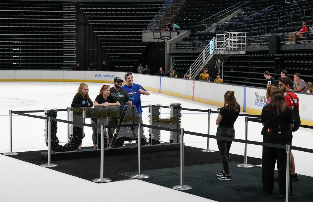 (Francisco Kjolseth  |  The Salt Lake Tribune) People pose for photographs on the ice as the Utah Hockey Club hosts their first NHL draft party at the Delta Center on Friday, June 28, 2024.