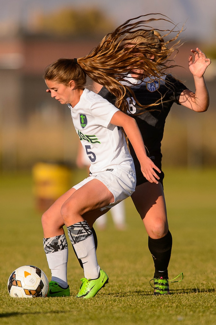 (Trent Nelson | The Salt Lake Tribune) Syracuse's Caroline Stringfellow (35) and Pleasant Grove's Mariah Lucas (8) in the Class 6A girls' soccer state quarterfinal between Pleasant Grove and Syracuse, in Syracuse Thursday October 12, 2017.