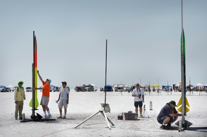 (Scott Sommerdorf   |  The Salt Lake Tribune)   David Spencer, left, sets up his rocket as Travis Tabbal, right, prepares his rocket "Fireball" for flight during "Hellfire" - the four day event sponsored by the Utah Rocket Club, Saturday, August 5, 2017.  
