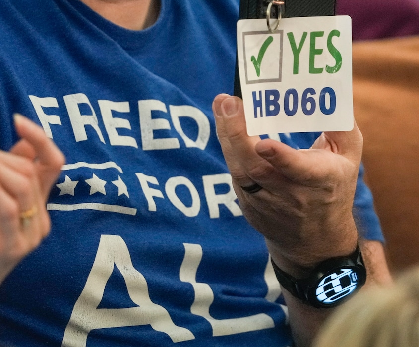 (Leah Hogsten | The Salt Lake Tribune) Supporters of HB60 were told to peel off stickers showing support for the measure during House floor time at the Capitol prior to the bill's passage, Feb. 22, 2022. HB60 blocks private businesses from requiring proof of vaccination for customers and employees.