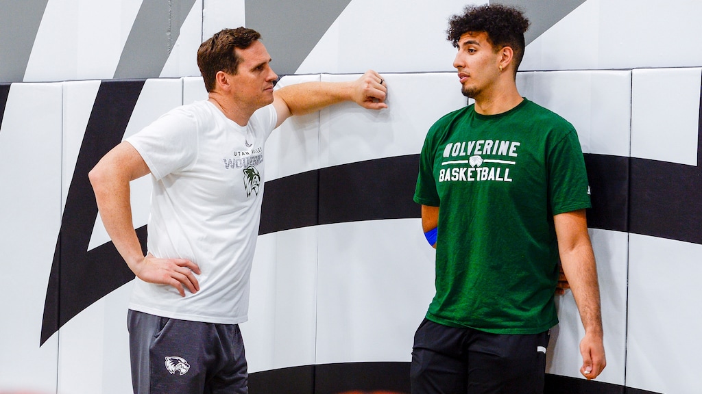 (Leah Hogsten | The Salt Lake Tribune) Utah Valley University basketball coach, Mark Madsen talks with team forward Fardaws Aimaq, Monday, July 1, 2019. Mark Madsen chose to trade in life with the L. A. Lakers for life as Utah Valley UniversityÕs mensÕ basketball head coach.