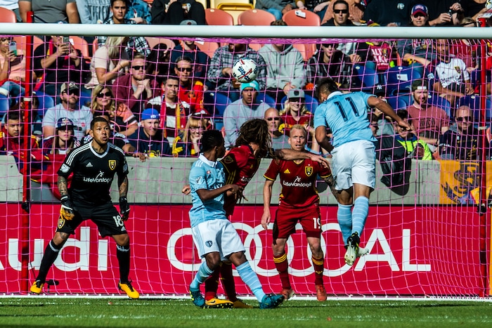 (Chris Detrick  |  The Salt Lake Tribune)  Sporting Kansas City forward Diego Rubio (11) attempts to head the ball into the goal past Real Salt Lake goalkeeper Nick Rimando (18) during the game at Rio Tinto Stadium Sunday, October 22, 2017.  