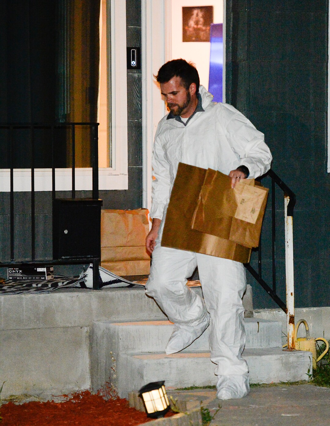 (Francisco Kjolseth  |  The Salt Lake Tribune)  Police investigators search a home at 547 N. 1000 West in Salt Lake City as part of the disappearance of University of Utah student MacKenzie Lueck on Wed. June 26, 2019.