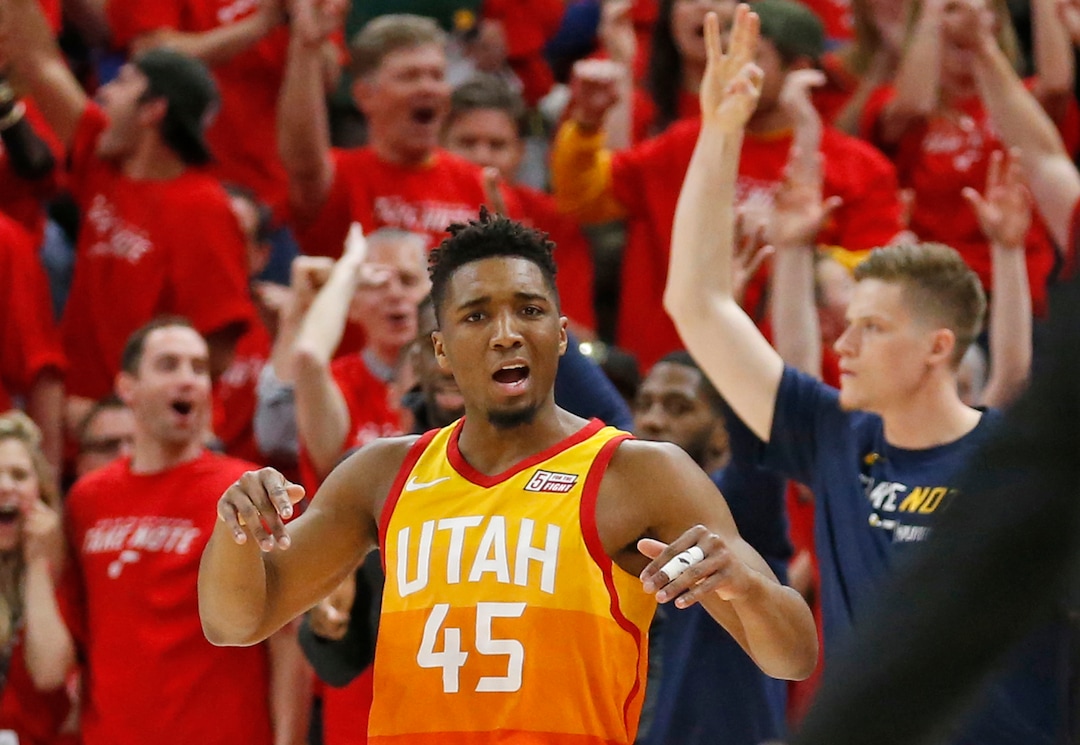 Utah Jazz guard Donovan Mitchell (45) celebrates after scoring a three-point basket against the Oklahoma City Thunder in the first half during Game 3 of an NBA basketball first-round playoff series Saturday, April 21, 2018, in Salt Lake City. (AP Photo/Rick Bowmer)