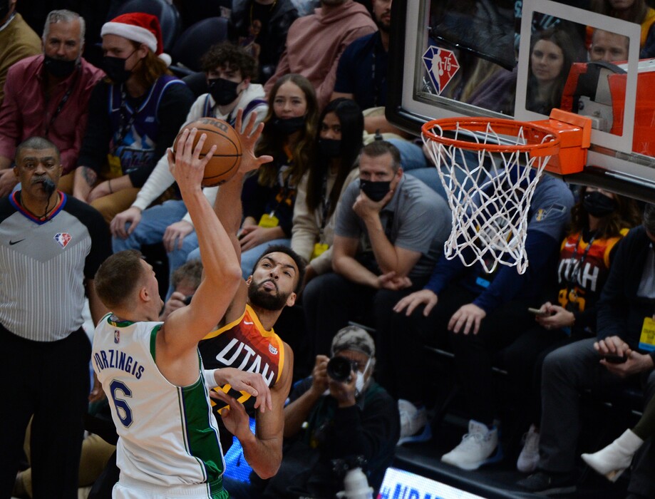 (Chris Samuels | The Salt Lake Tribune) Rudy Gobert, right, tries to block a shot from Kristaps Porzingis (6) as the Utah Jazz play the Dallas Mavericks at Vivint Arena Saturday, Dec. 25, 2021.