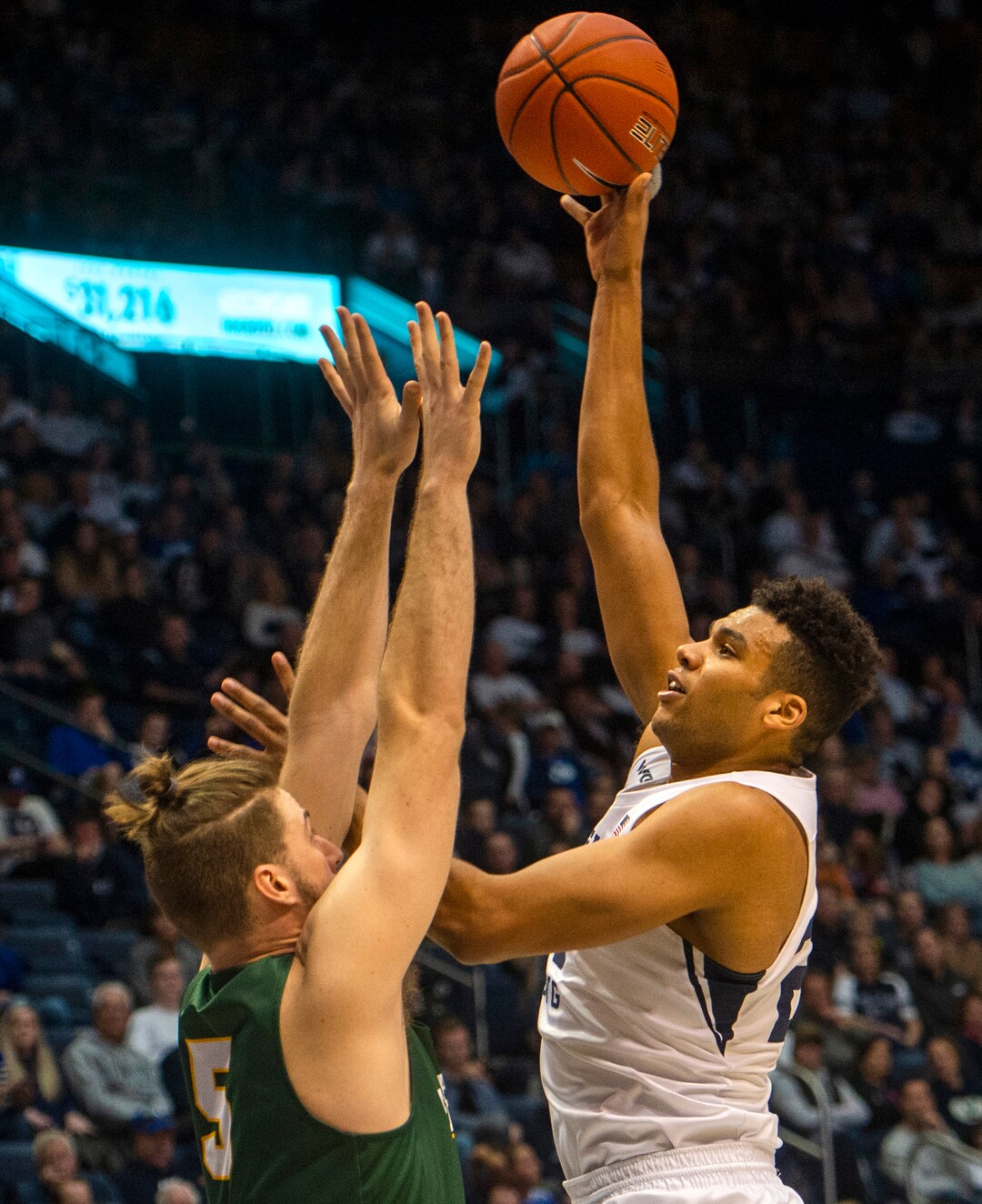 (Rick Egan  |  The Salt Lake Tribune)    Brigham Young Cougars forward Yoeli Childs (23) shoots over San Francisco Dons center Jimbo Lull (5), in WCC basketball acton between the Brigham Young Cougars and the San Francisco Dons, at the Marriott Center, Saturday, Feb. 8, 2020.