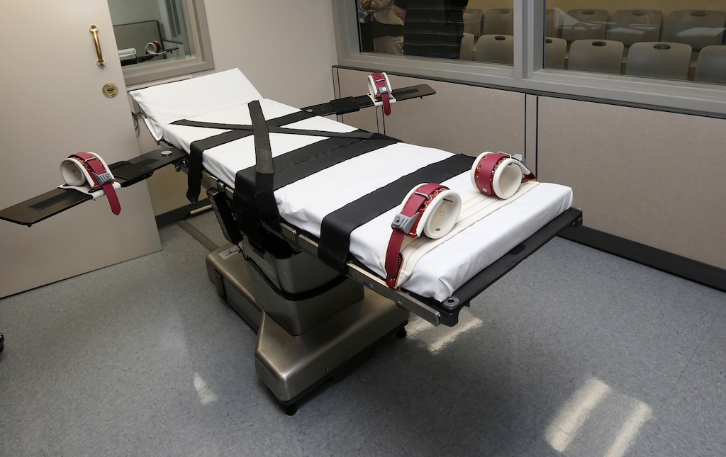 FILE - In this Oct. 9, 2014, file photo, the gurney stands in the execution chamber at the Oklahoma State Penitentiary in McAlester, Okla. (AP Photo/Sue Ogrocki, File)