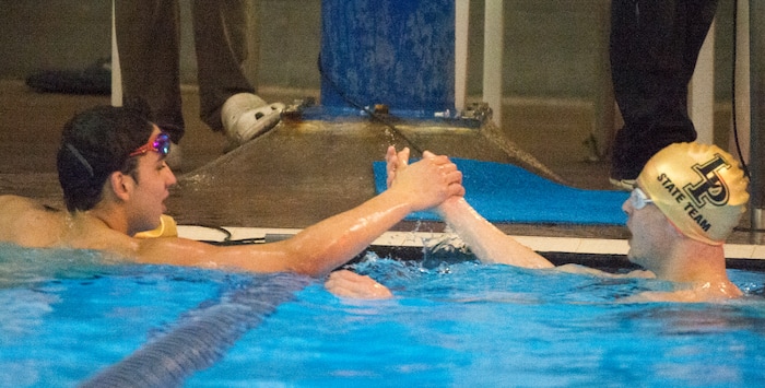 (Rick Egan  |  The Salt Lake Tribune)    Lone Peak Swimmer, Josh Ries (left) shakes hands with Braden Tiffany, Lone Peak, after Ries places first place in the Men's 100 Yard Backstroke, in 6A State Swimming Championships in Bountiful, Friday, February 9, 2018.