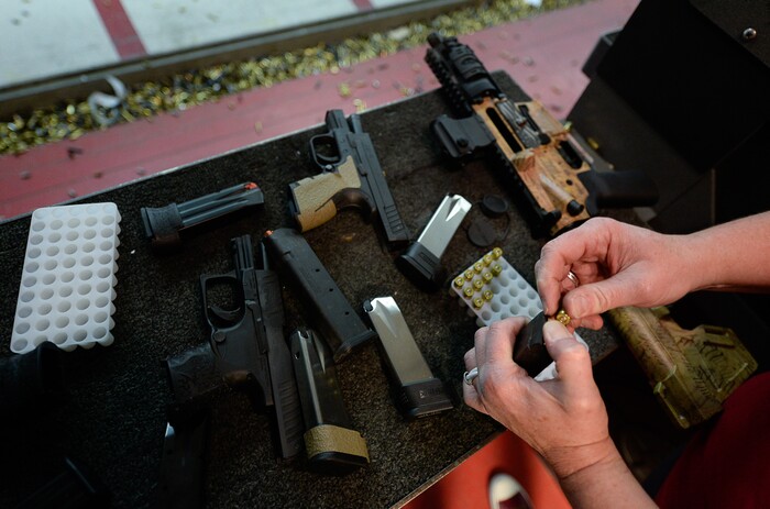 (Francisco Kjolseth  |  The Salt Lake Tribune)  Melanie Lewis loads bullets at The Gun Vault in South Jordan. Lewis of Kearns is a member of The Well-Armed Woman group. Of the concealed carry permits issued by the state, only about one in five is held by a woman.