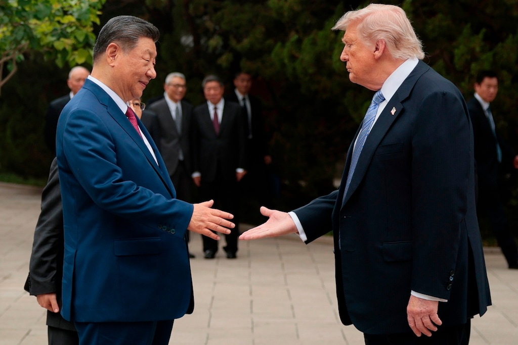 FILE - U.S. President Donald Trump, right, shakes hands with Chinese President Xi Jinping while leaving after a visit to the Zhongnanhai Garden in Beijing, Friday, May 15, 2026. (Evan Vucci/Pool Photo via AP, file)