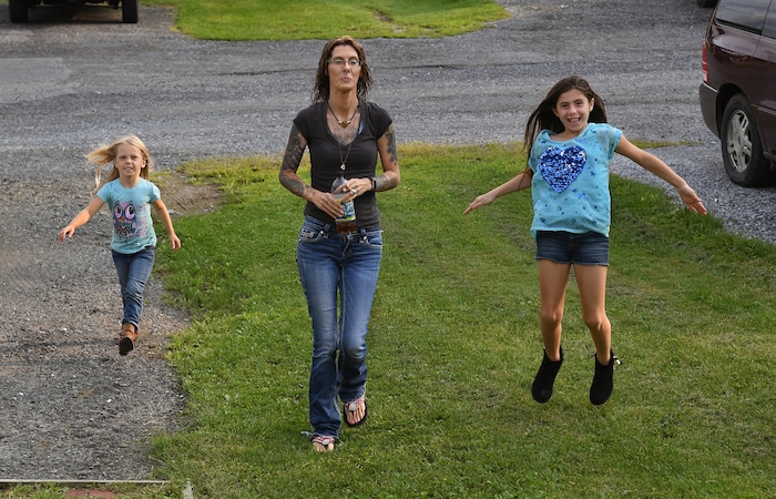 (Washington Post photo by Michael S. Williamson) Maria's mom, Michelle Hockenberry, arrives at her daughter's mobile home with Moon Hockenberry (left) and Nadia Cogan, who were excited to see their stepsister.