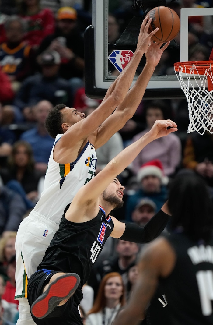 (Francisco Kjolseth | The Salt Lake Tribune) Utah Jazz center Rudy Gobert (27) pushes past LA Clippers center Ivica Zubac (40) in NBA action between the Utah Jazz and the LA Clippers at Vivint Smart Home Arena in Salt Lake City, Wednesday, Dec. 15, 2021.