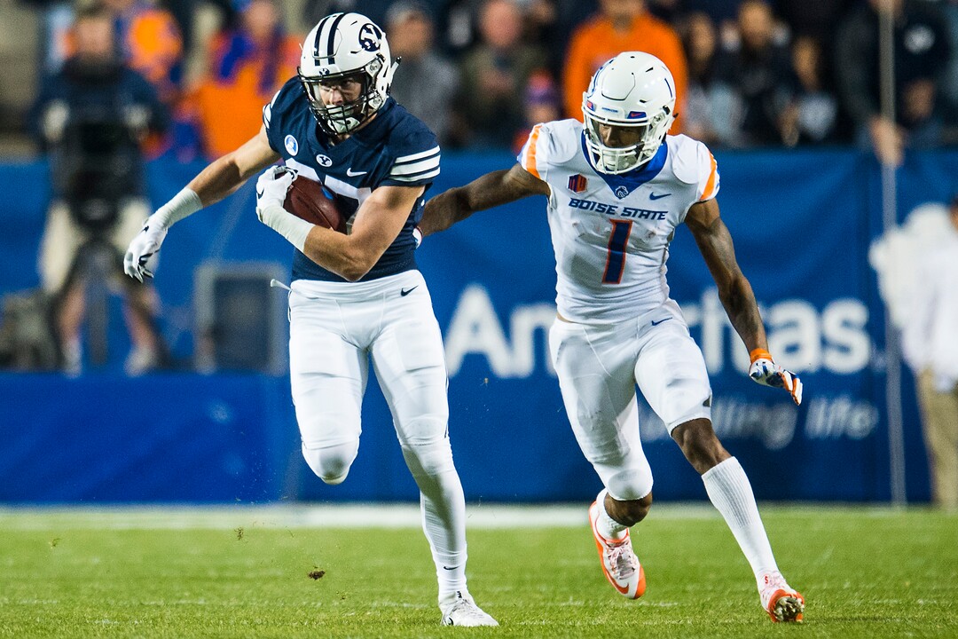 (Chris Detrick  |  The Salt Lake Tribune)  Brigham Young Cougars wide receiver Grant Jones (37) makes an interception past Boise State Broncos wide receiver Cedrick Wilson (1) during the game LaVell Edwards Stadium Friday, October 6, 2017. 