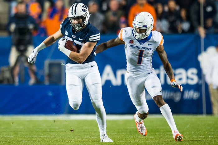 (Chris Detrick  |  The Salt Lake Tribune)  Brigham Young Cougars wide receiver Grant Jones (37) makes an interception past Boise State Broncos wide receiver Cedrick Wilson (1) during the game LaVell Edwards Stadium Friday, October 6, 2017. 