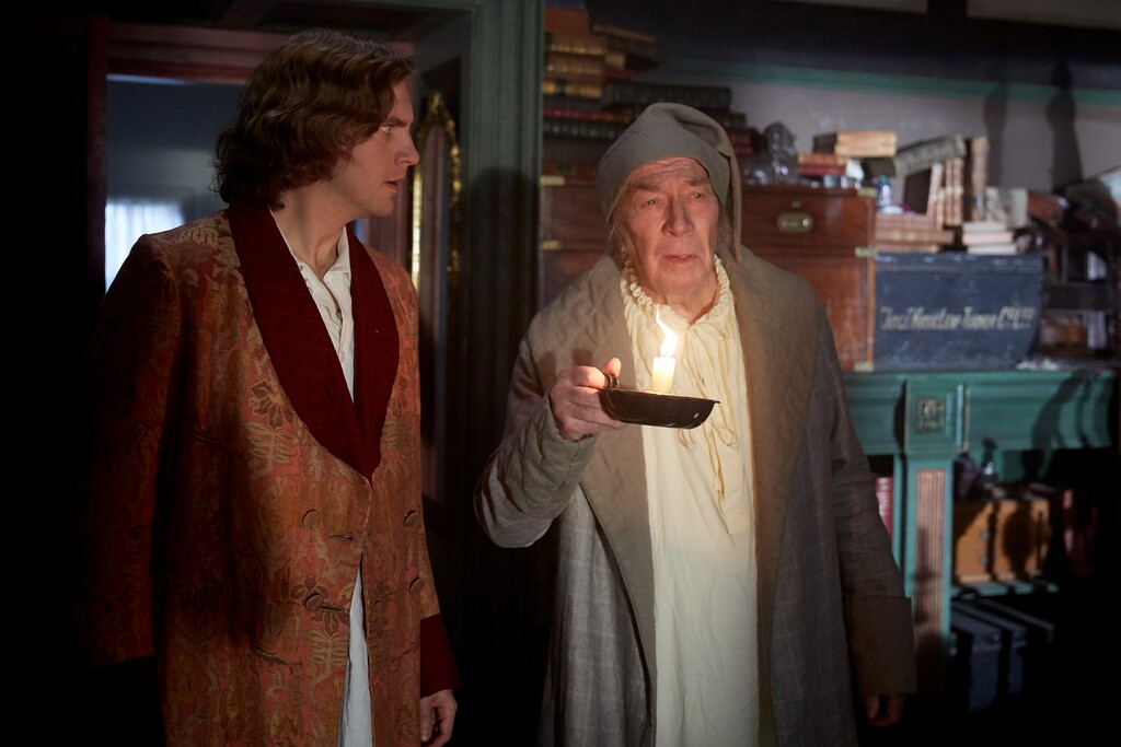 (Kerry Brown  |  Bleecker Street Films) Charles Dickens (Dan Stevens, left) conjures up his new character, Ebenezer Scrooge (Christopher Plummer), in the biographical comedy-drama "The Man Who Invented Christmas."