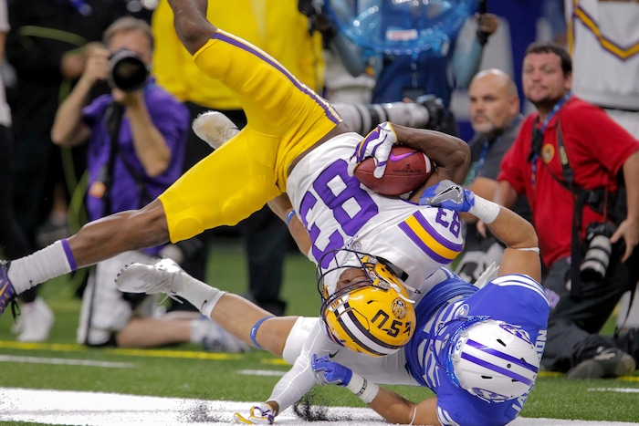 LSU wide receiver Russell Gage (83) catches a pass against BYU defensive back Tanner Jacobson (25) during the second half of an NCAA college football game in New Orleans, Saturday, Sept. 2, 2017. (AP Photo/Scott Threlkeld)
