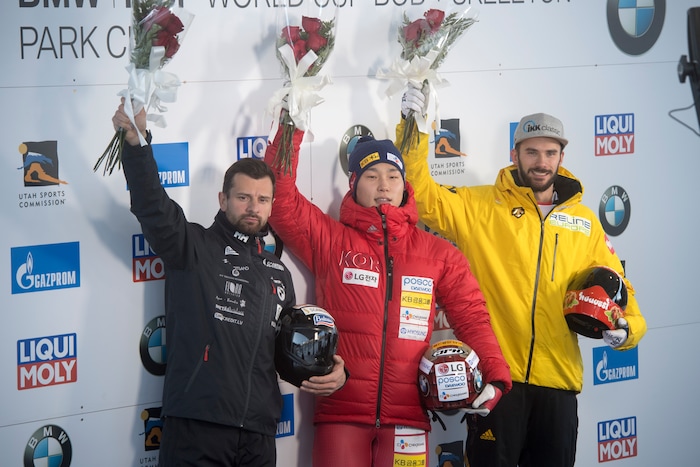 (Rick Egan  |  The Salt Lake Tribune)   Martins Dukurs, Latvia, 2nd place, Sungbin Yun, Korea 1st place and Axel Jungk, Germany, in the BMW IBSF World Cup Men's Skeleton competition, Saturday, November 18, 2017.