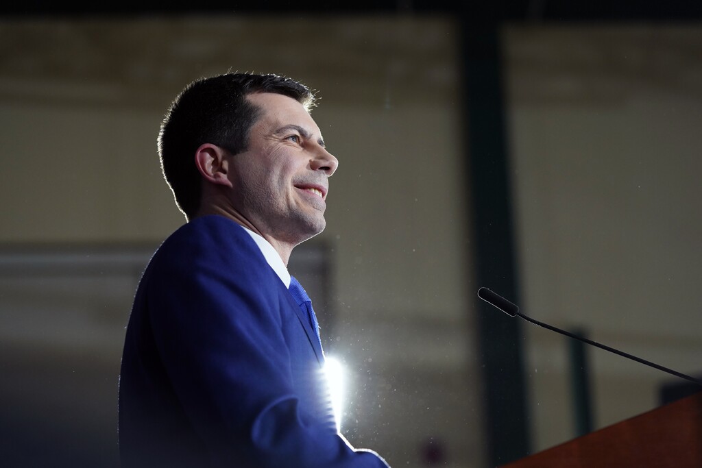 (Tamir Kalifa |The New York Times) Former Mayor Pete Buttigieg of South Bend, Ind., a Democratic candidate for president, smiles as he is cheered by attendees at a primary night gathering in Nashua, N.H., on Feb. 11, 2020. Buttigieg is moving to replenish his campaign coffers with an ambitious schedule of 10 fundraisers held across six states in a 14-day period.