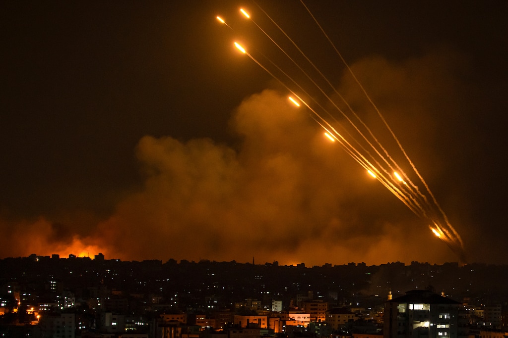 (Fatima Shbair | The Associated Press) Rockets are fired toward Israel from the Gaza Strip, Sunday, Oct. 8, 2023.